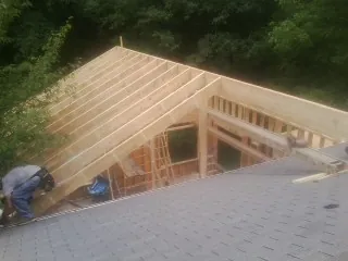 Framing a new roof addition that ties into an existing shingle roof in Krotz Springs